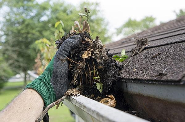 some signs that your gutters need cleaning include water overflow and visible debris inside the gutters